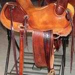 Rancher - 2tone, straight-back, stirrup lthrs out and tooled, full baskt wv, barbed wire w channels, latigo, floral