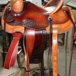 Lady Rancher-Santa Fe diamond w S-swirl,corner Santa Fe Diamond,latigo wrap,straight-back cantle,2 tone leather,stirrup leathers outside,2 inch bell stirrups, floral conchos