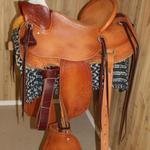 Lady Wade - Full bskt wv seat and front, corner basket wv, mule hide, straight-back, tapaderos, lady fenders, floral conchos