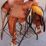 Rancher -barbed wire border, latigo wrap, overshoe stirrups, star conchos, straight-back